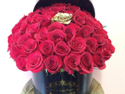 RED ROSES WITH GOLD IN MIDDLE IN ROUND BLACK BOX