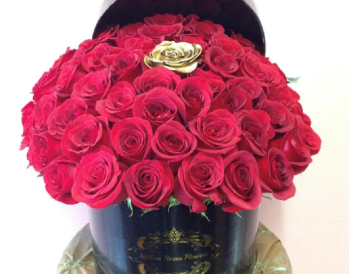 RED ROSES WITH GOLD IN MIDDLE IN ROUND BLACK BOX