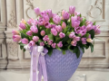 80 lavender tulips in a lavender vase