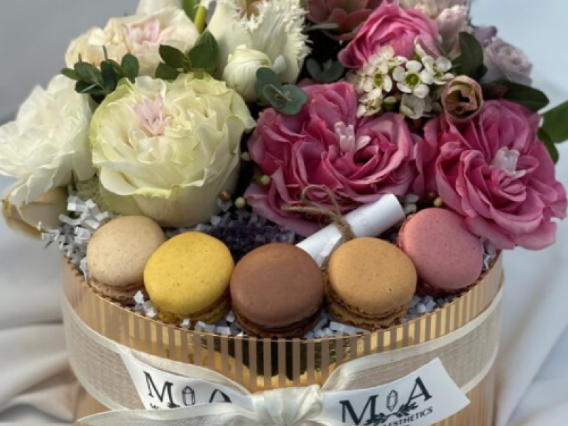 Beautiful box with macarons and flowers.